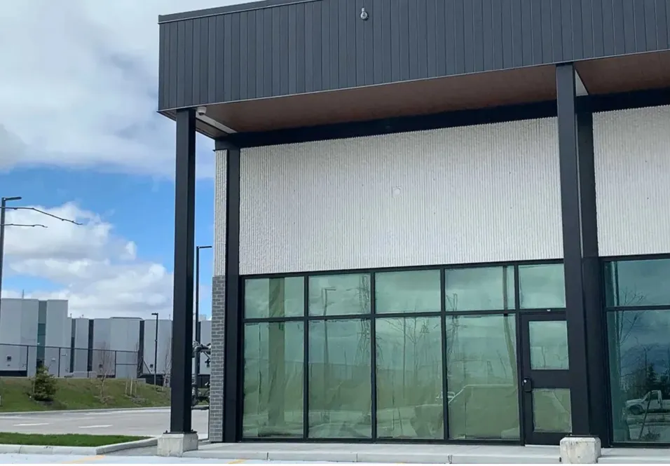 Photo of a Silver Star Blvd storefront with glass walls under a dark canopy.