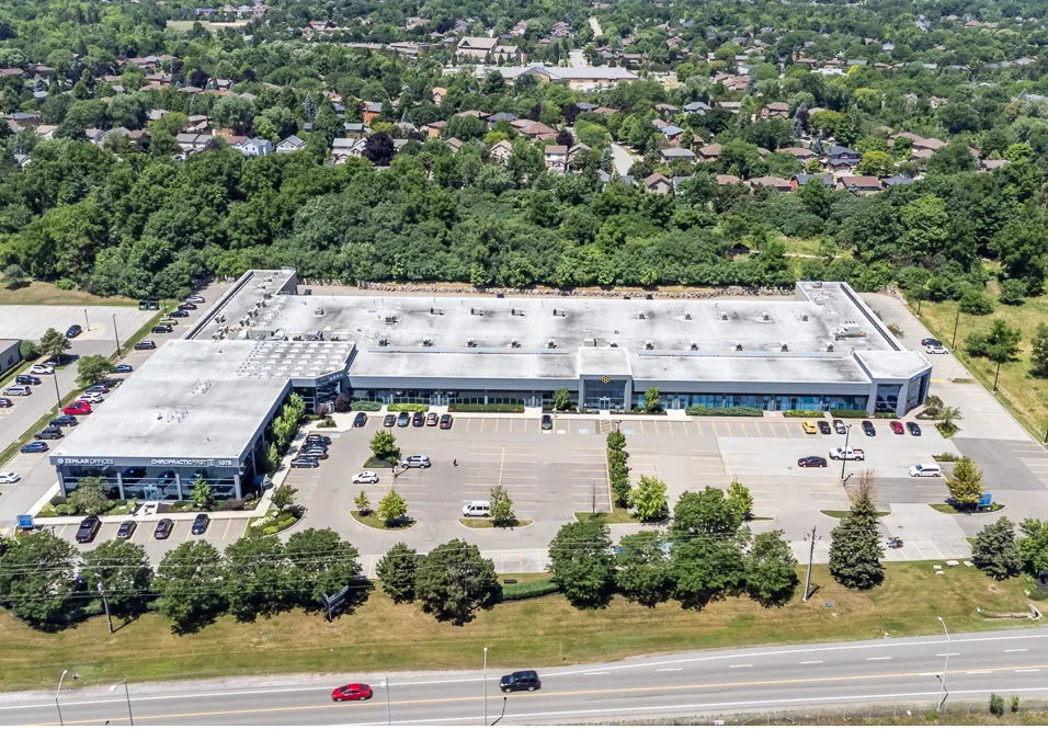 Photo of the business park from above, with parking and a road in front.