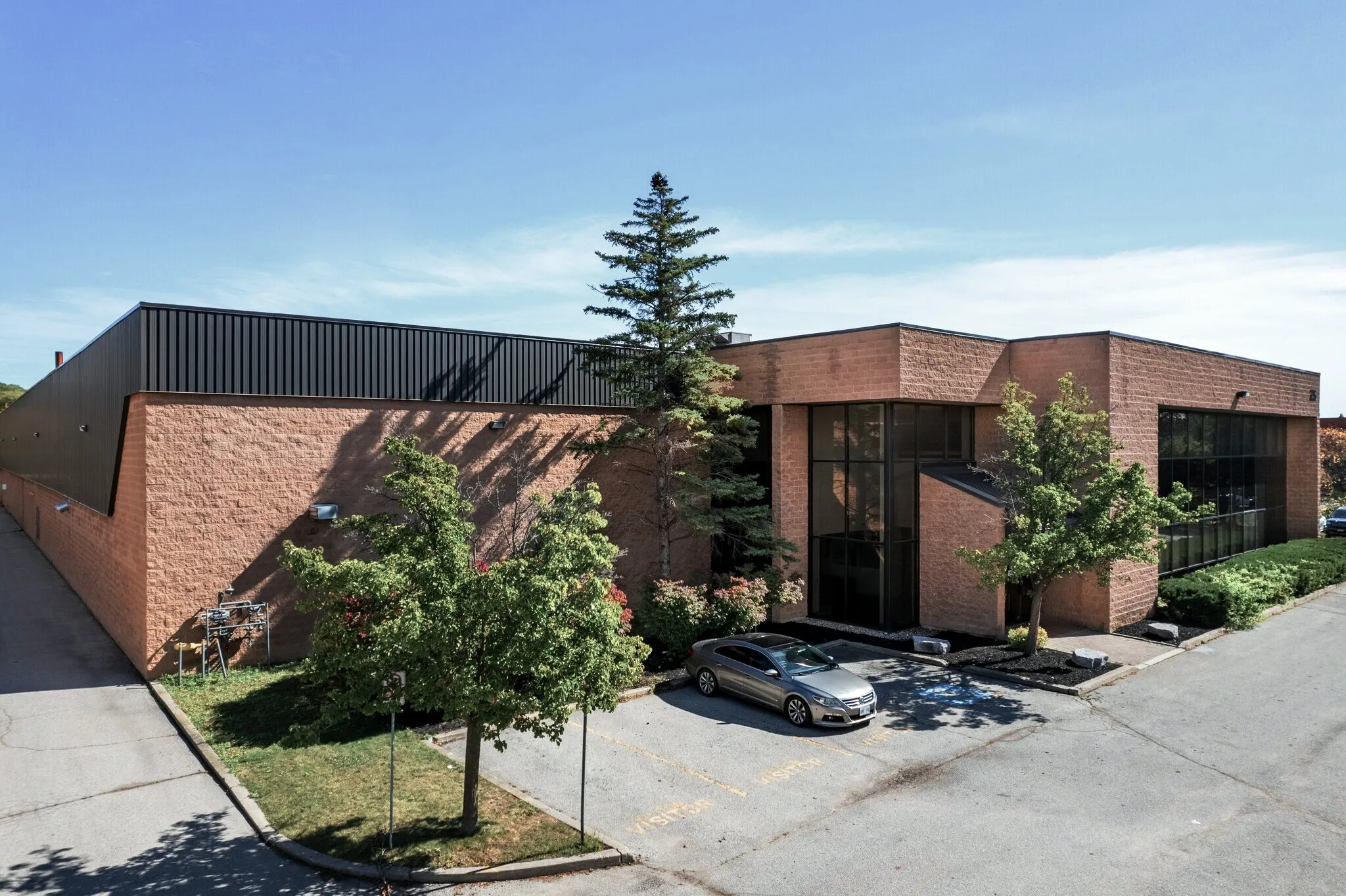 Photo of the Mural Industrial building with tan block walls and a glazed entrance.