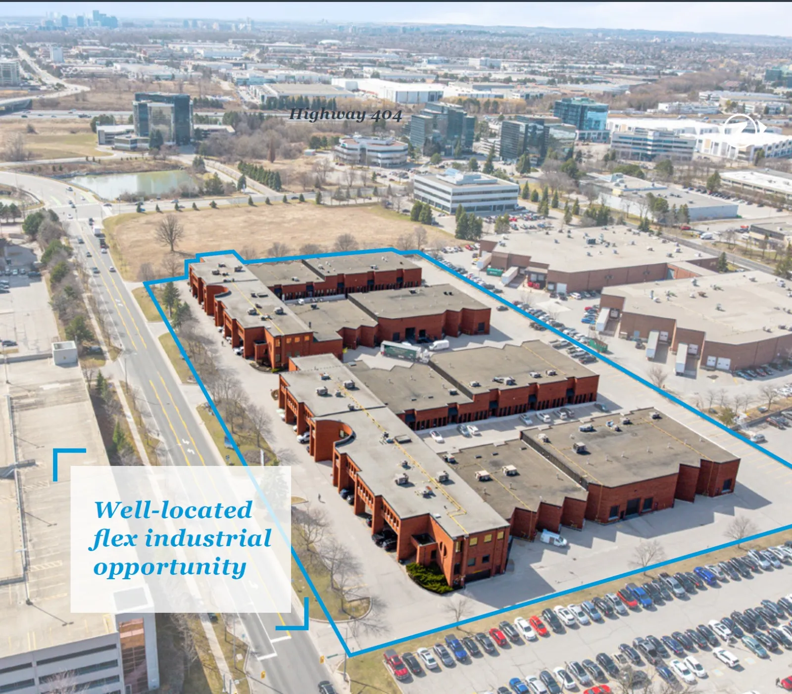 Photo of the brick industrial campus from above, outlined in blue, near Highway 404.